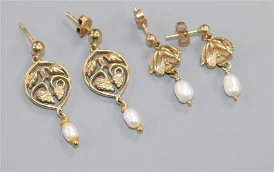Two pairs of yellow metal and cultured pearl drop earrings, one pair stamped 9ct gold and modelled as snowdrops,